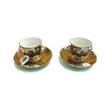 Two Berlin porcelain trembleuese two handled cups and saucers, late 19th century,