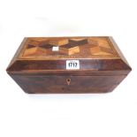 An early 19th century yew wood specimen deceptive cube parquetry inlaid tea caddy of sarcophagus