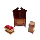 A miniature mahogany linen press, with fitted interior, 27cm wide x 40cm high,