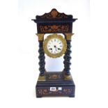 A French ebonised portico mantel clock, 19th century,