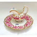 A Victorian matched part tea service decorated with roses against a gilt white ground,