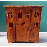 A 16th century style stained elm aumbry,