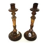 A pair of 18th century turned giltwood candlesticks, probably French,