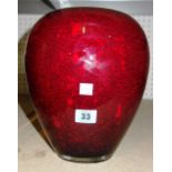 A red glass studio vase, post war, with internal white enamel casing and a mottled red exterior,