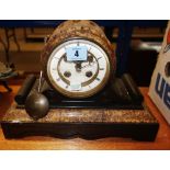 A 19th century black slate and marble cased eight day mantel clock.