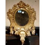 A pair of Continental 18th century style gilt metal wall mirrors,