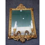 A 19th century gilt framed rectangular wall mirror, with moulded frame and twin light girandole,