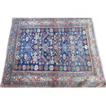 A Shirvan rug, Caucasian, the indigo field with four spiked diamonds and pairs of leaves,