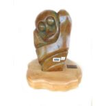 Richard Mteki; a carved opalstone figure raised on a shaped wooden plinth, Zimbabwe 1998,