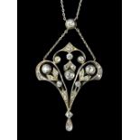 A diamond set pendant, in an Art Nouveau pierced openwork and foliate design,