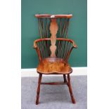 A 19th century and later Thames Valley yew and elm comb back Windsor chair, on turned supports.