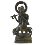 An Indian bronze group of Krishna as a cowherd,