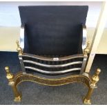 An 18th century style steel and brass fire basket, with pierced serpentine front and turned finials,