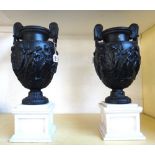 A pair of modern resin models of the Townley vases,