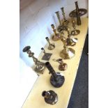 Eleven 18th century and later brass candlesticks,