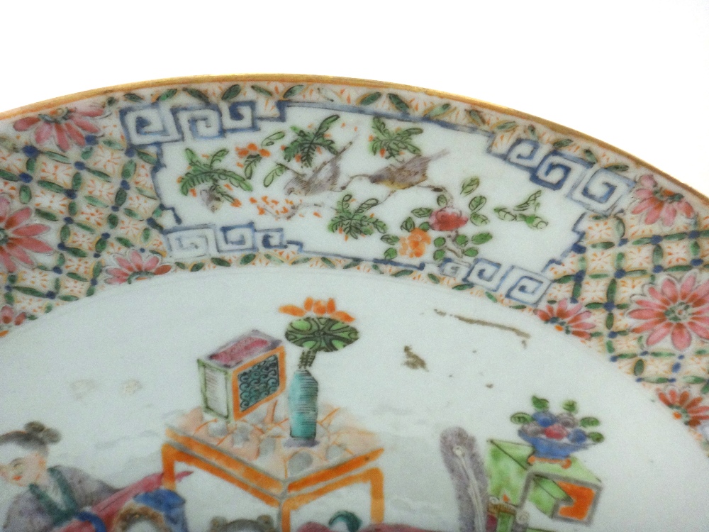 A Chinese famille-rose circular dish, circa 1900, painted with figures at leisure amongst tables, - Image 2 of 4