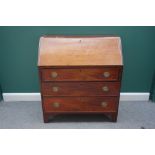 A George III mahogany bureau, the fall enclosing a fitted interior, over three long drawers,