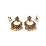 A pair of Middle Eastern gold filigree and turquoise set earclips, each of circular form,