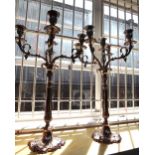 A pair of Louis XVI style silver plated five branch candelabra, modern, of foliate scroll form,