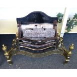 An 18th century style steel and brass fire basket, with pierced serpentine front and urn finials,