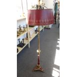 An Empire style bouillotte standard lamp with burgundy gilt tin shade,