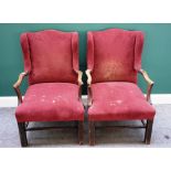 A pair of George III mahogany framed wing back open armchairs, on square supports.