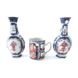 A pair of Chinese famille-rose hexagonal baluster vases, Qianlong,
