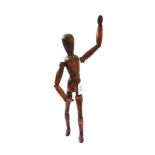A French stained beech artist's lay figure, 20th century, with articulated joints, 31cm high.