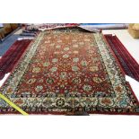A Romanian rug, the madder field with all over flowers and palmettes,