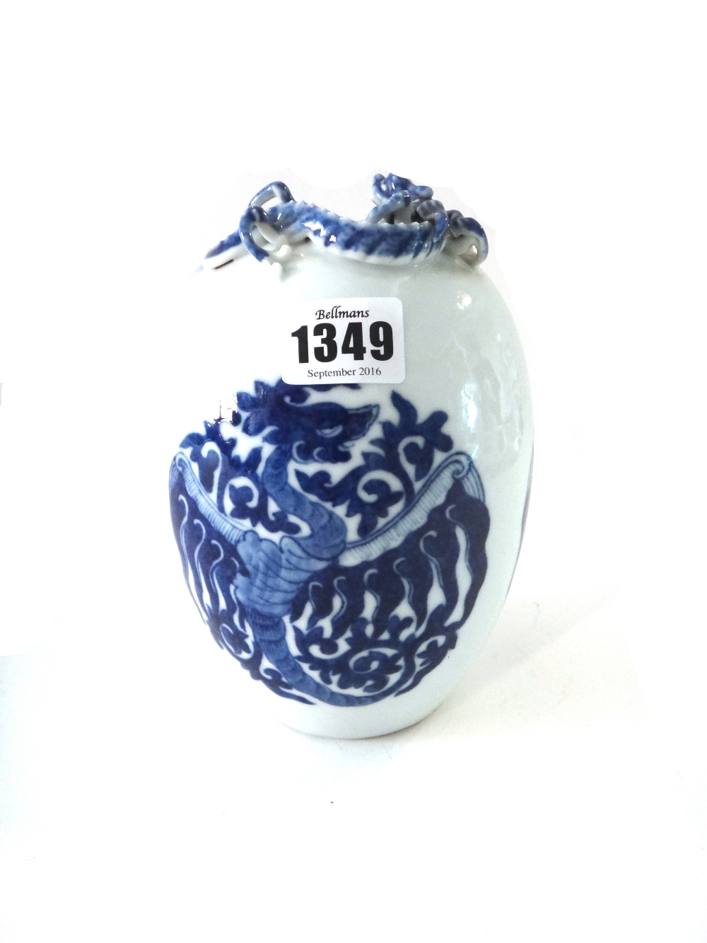 A Chinese blue and white egg-shaped vase, 20th century, painted with phoenix roundels,