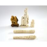 A small Indian ivory carving of a man and child, late 19th/early 20th century,