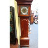 An early 18th century fruitwood cased 30 hour longcase clock with plain dial flanked by pillared