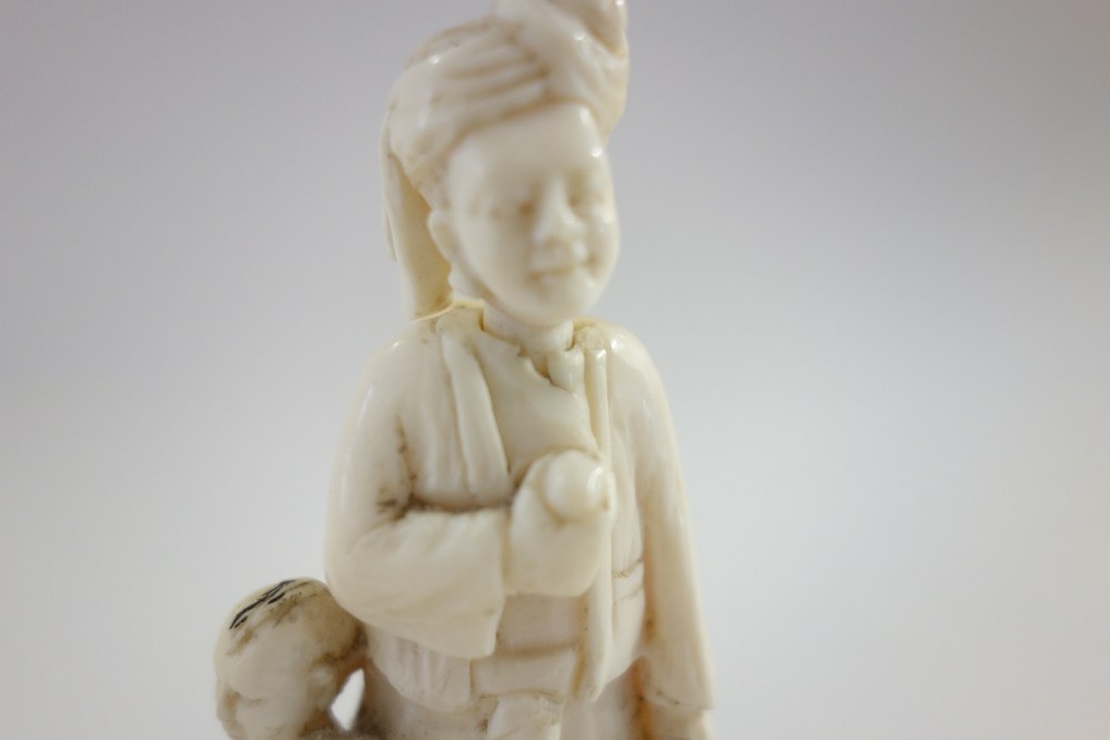 A small Indian ivory carving of a man and child, late 19th/early 20th century, - Image 7 of 9
