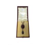 A carbuncle garnet and rose diamond set pendant necklace,