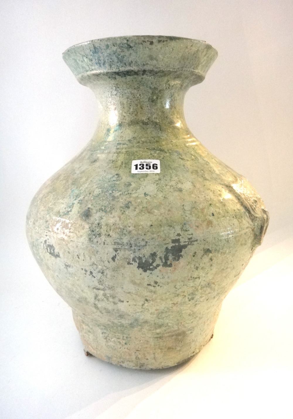 A Chinese green glazed pottery wine jar, Hu, Han Dynasty,