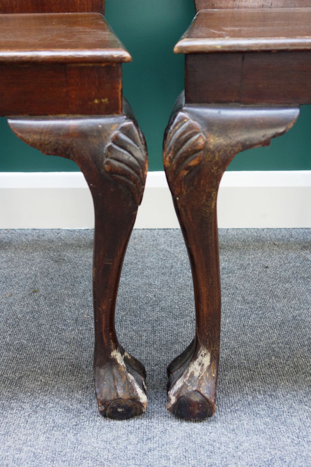 A pair of 19th century mahogany hall chairs, the shaped backs with carved face masks, - Image 3 of 3