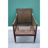 An early 19th century mahogany framed library bergère,