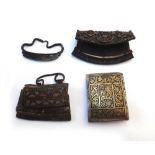 Two Tibetan leather flint and tinder pouches with iron strike plate,