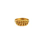 A late Victorian 18ct gold gentleman's ring, in a beaded and interwoven design, London 1899,