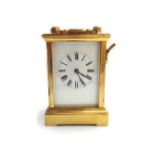 A gilt brass cased carriage clock, 19th century, hour repeat chiming on a gong,