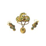 A Victorian gilt metal and turquoise set brooch, in a scrolling design,
