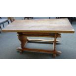 A 17th century style North European oak refectory table, with slide out under drawer,