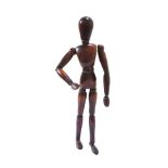 A French stained beech artist's lay figure, 20th century, with articulated joints, 31cm high.