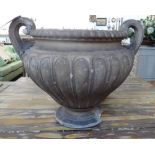 A pair of 19th century stone effect two handled garden urns, with lobed bodies, (a.