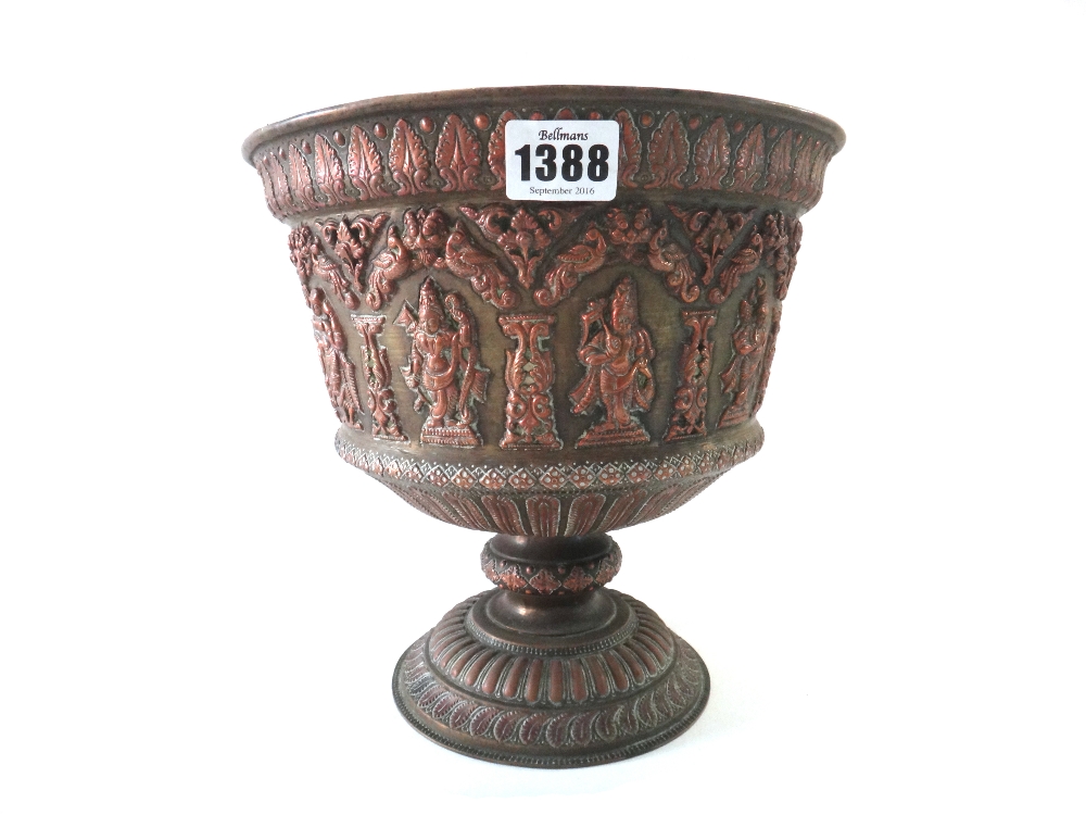 An Indian brass and copper bowl, 19th century, of flared form,