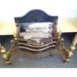 An 18th century style steel and brass fire basket, with pierced serpentine front and urn finials,