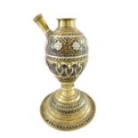 An Ottoman coconut and inlaid hookah base, 19th century, raised on a brass domed circular base,