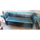 A 20th century green painted hardwood bench, with slatted seat, on block supports, 201cm wide.