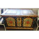 A 19th century Tyrolean polychrome rectangular painted trunk with double panel lid and sides,