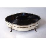 A silver and tortoiseshell jewel box, probably Birmingham 1910, of shaped oval outline,